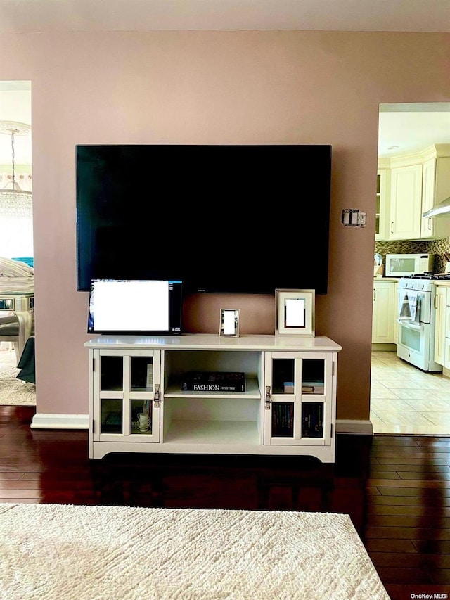 135-12 122nd Pl, South Ozone Park, NY 11420 - unfurnished living room featuring hardwood / wood-style floors
