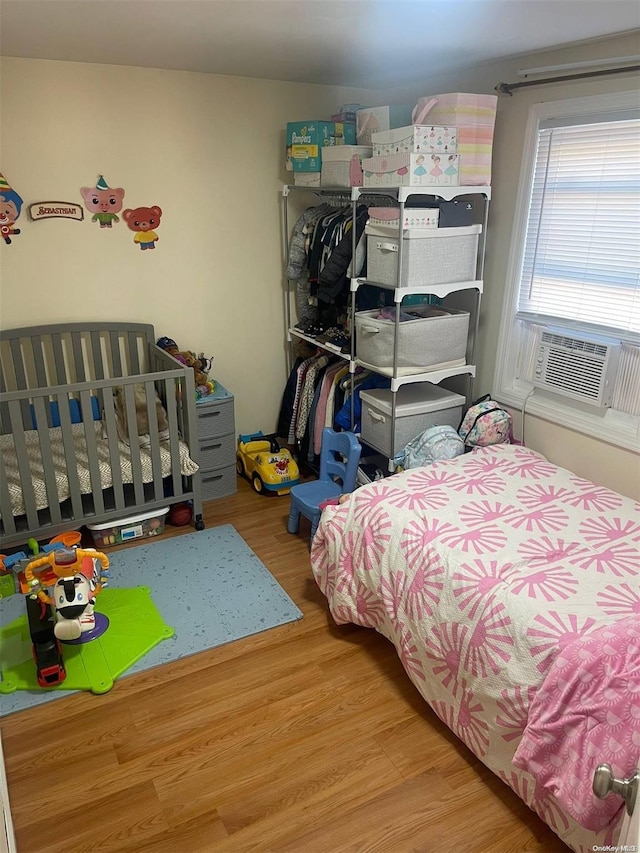 bedroom featuring hardwood / wood-style flooring