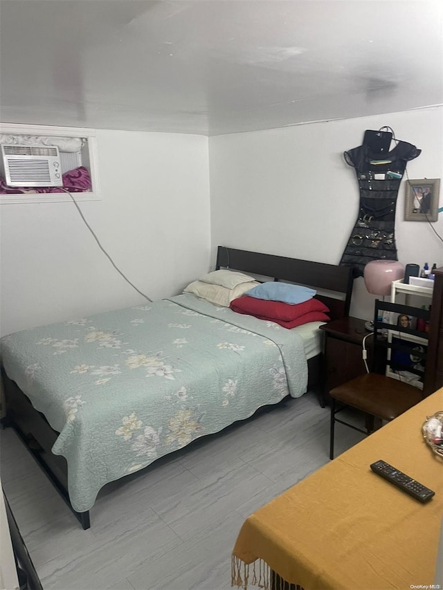 bedroom with a wall mounted air conditioner