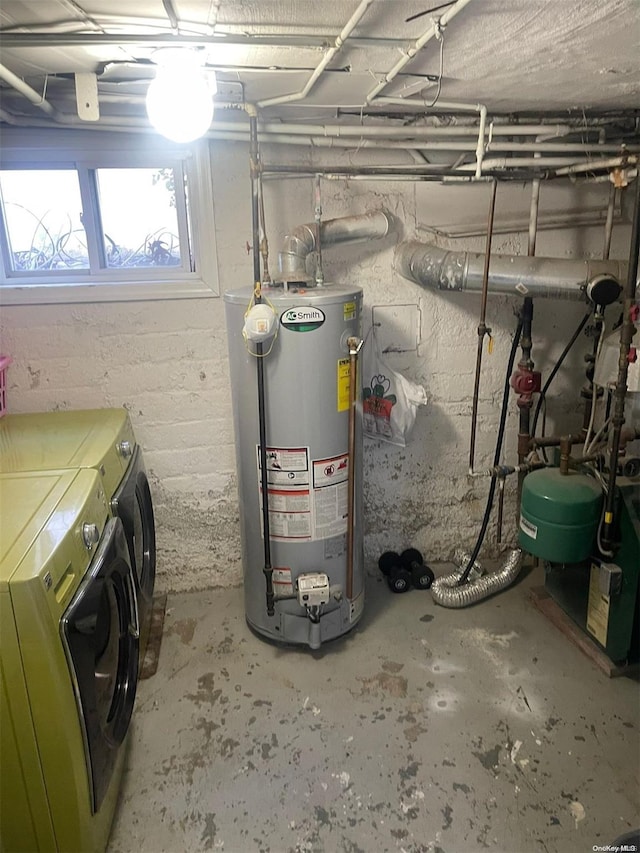 utility room with washer and clothes dryer and gas water heater