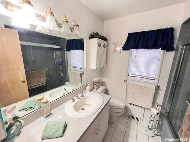 full bathroom with tile patterned floors, vanity, toilet, and plus walk in shower