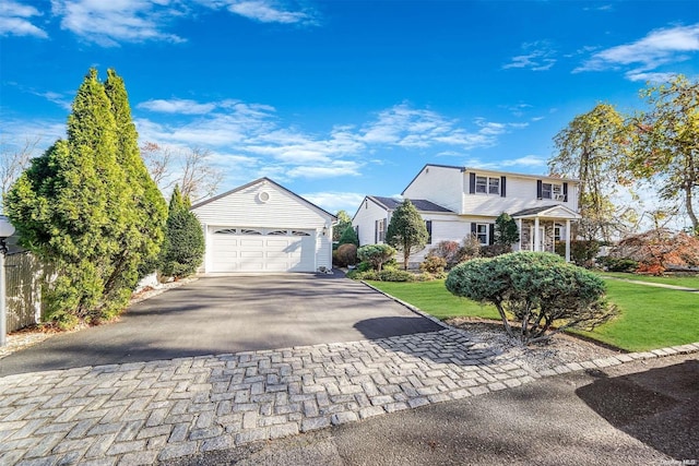 view of front of house with a garage and a front yard