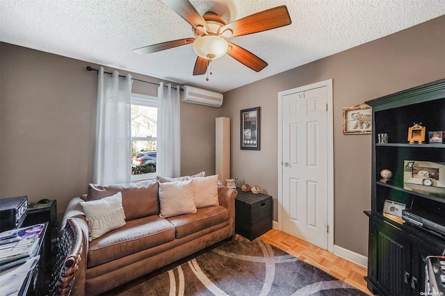 living room featuring ceiling fan, a textured ceiling, parquet floors, and a wall mounted air conditioner