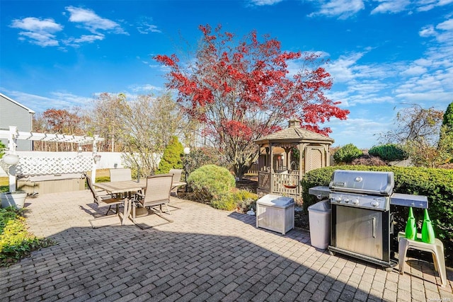 view of patio / terrace with area for grilling and a gazebo