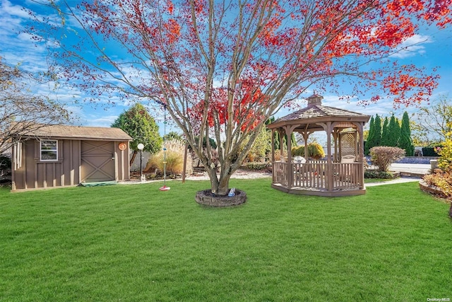 view of yard with a gazebo and a storage shed