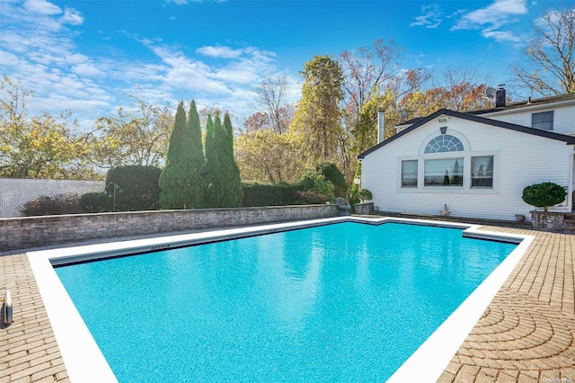 view of swimming pool with a patio area