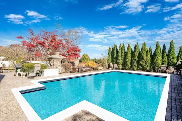 view of pool with a gazebo and a patio