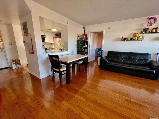 dining area featuring hardwood / wood-style flooring