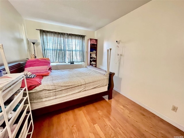 bedroom featuring hardwood / wood-style flooring