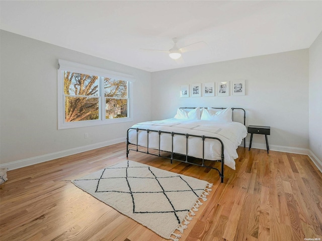 bedroom featuring ceiling fan and light wood-type flooring