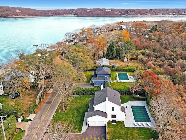 birds eye view of property with a water view