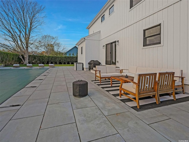 exterior space featuring an outdoor hangout area and a patio area