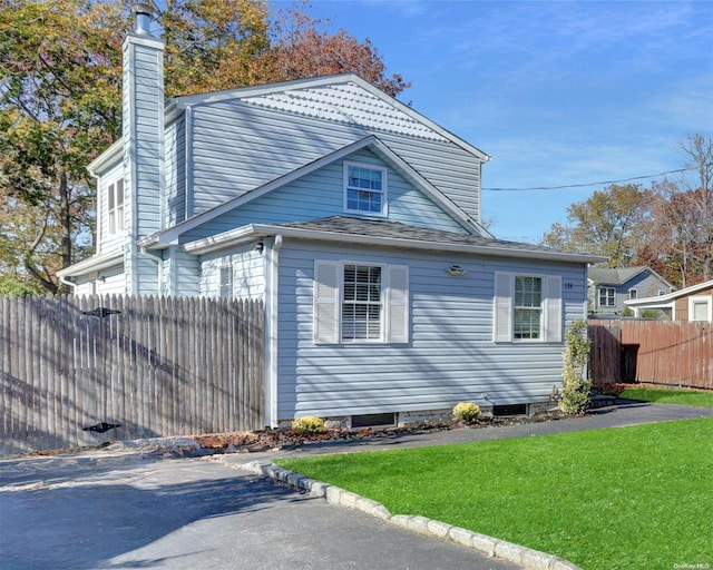 view of home's exterior featuring a yard