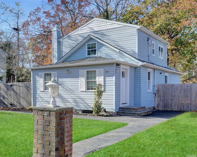 view of front of property with a front lawn