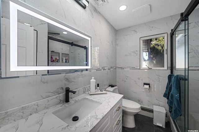 bathroom with vanity, an enclosed shower, tile walls, and toilet