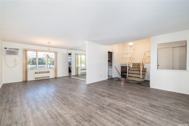 unfurnished living room featuring radiator heating unit, dark wood-type flooring, and a wall mounted AC