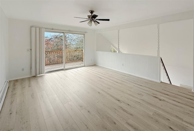 unfurnished room with vaulted ceiling, ceiling fan, and light hardwood / wood-style flooring