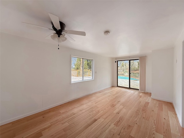 unfurnished room with light wood-type flooring and ceiling fan