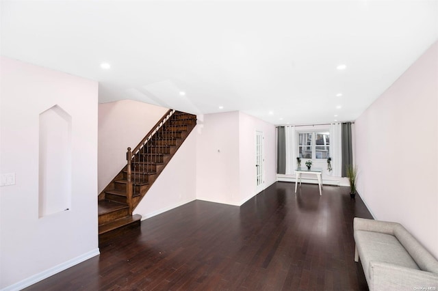 unfurnished living room featuring dark hardwood / wood-style floors