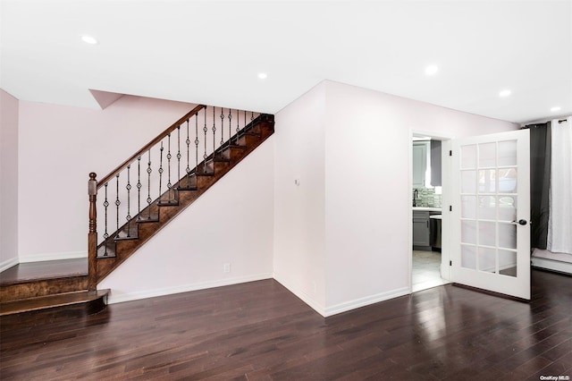 interior space with hardwood / wood-style flooring and baseboard heating