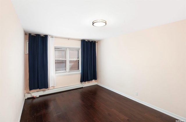 empty room with a baseboard radiator and wood-type flooring