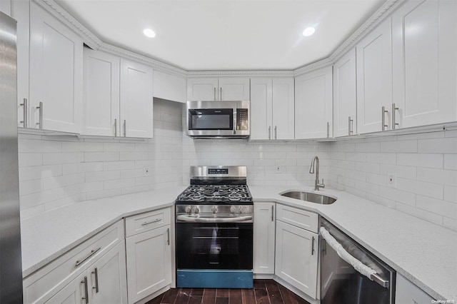 kitchen featuring white cabinets, dark hardwood / wood-style flooring, stainless steel appliances, and sink