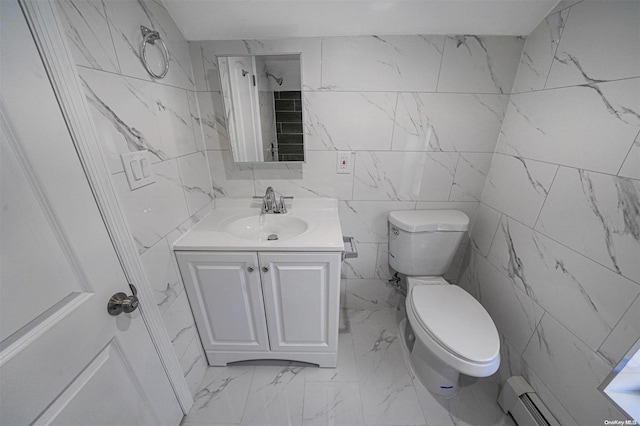 bathroom featuring baseboard heating, vanity, tile walls, and toilet