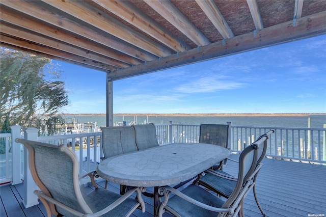 wooden deck featuring a water view