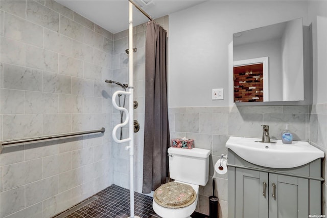 bathroom with a shower with curtain, vanity, tile walls, and toilet