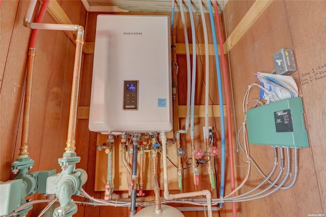 utility room with tankless water heater