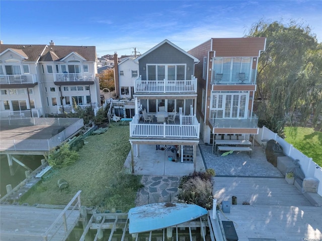 rear view of house featuring a balcony