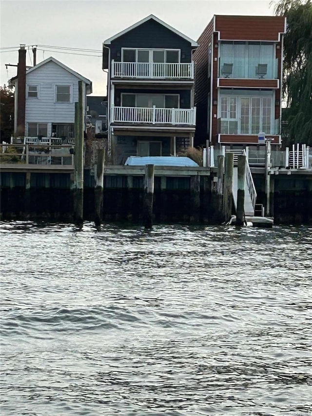 back of house with a water view