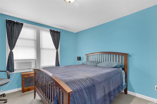 bedroom with light carpet and cooling unit