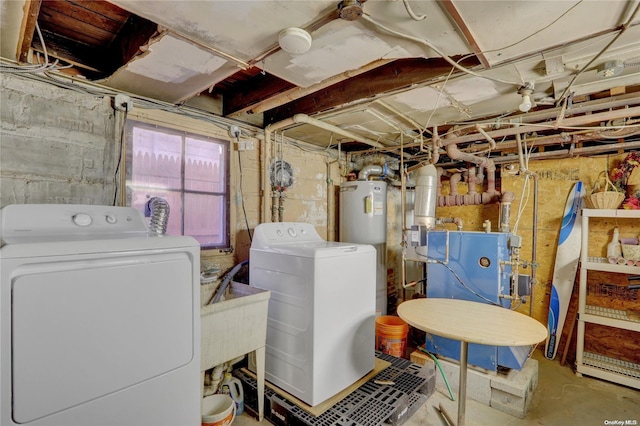 basement with independent washer and dryer and water heater