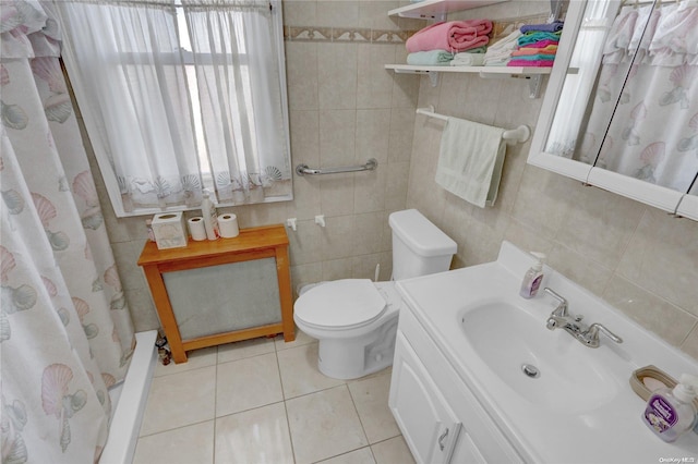 bathroom with tile patterned flooring, toilet, tile walls, and walk in shower