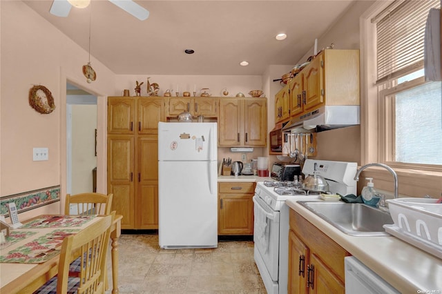 kitchen with white appliances, ceiling fan, and sink