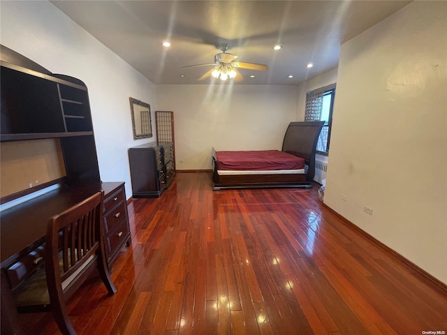 bedroom with dark wood-type flooring