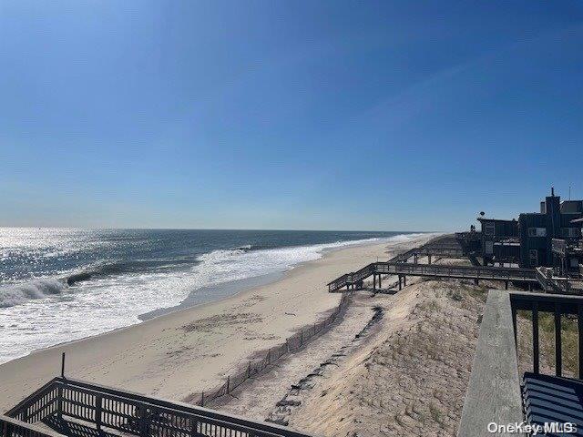 property view of water featuring a beach view