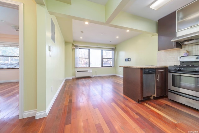 kitchen with backsplash, dark brown cabinets, dark hardwood / wood-style floors, and appliances with stainless steel finishes