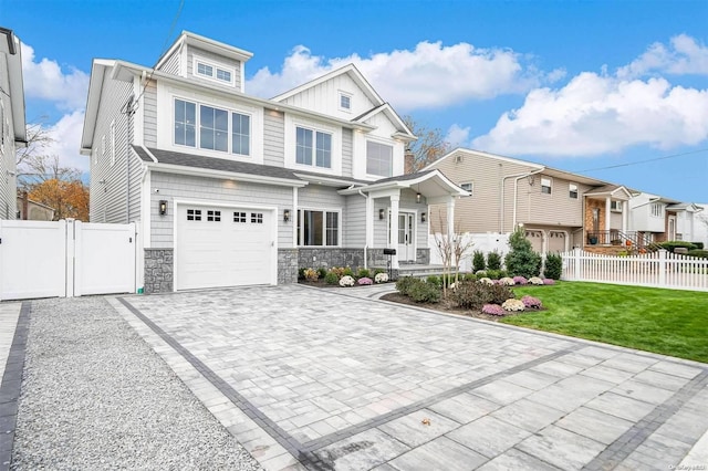 view of front facade featuring a front yard and a garage