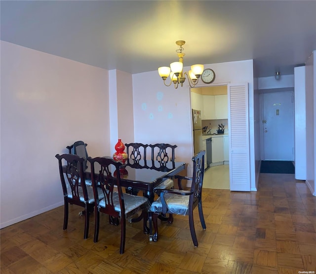 dining space featuring a notable chandelier