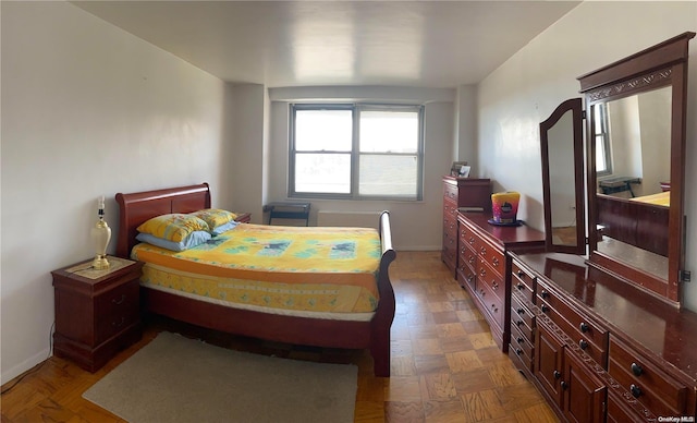 bedroom with parquet flooring