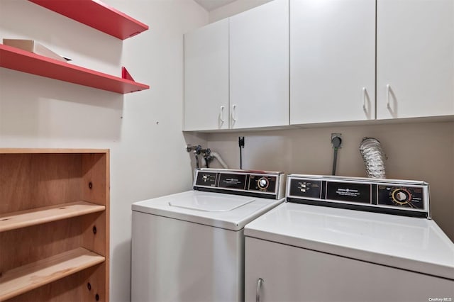 laundry room with cabinets and separate washer and dryer