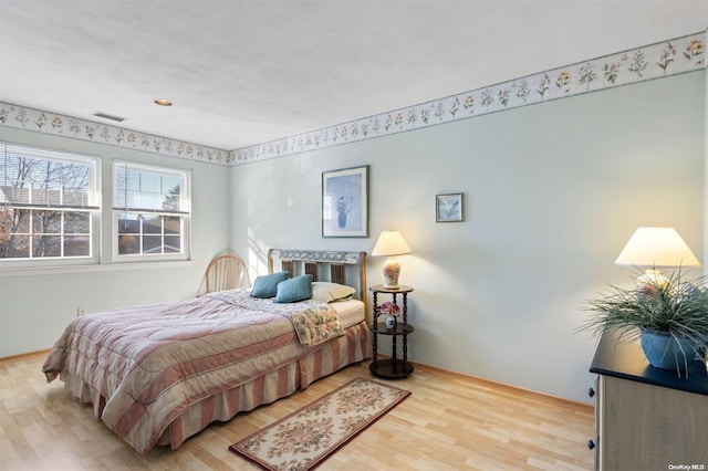 bedroom with light hardwood / wood-style floors