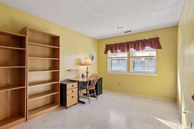 office with wood-type flooring