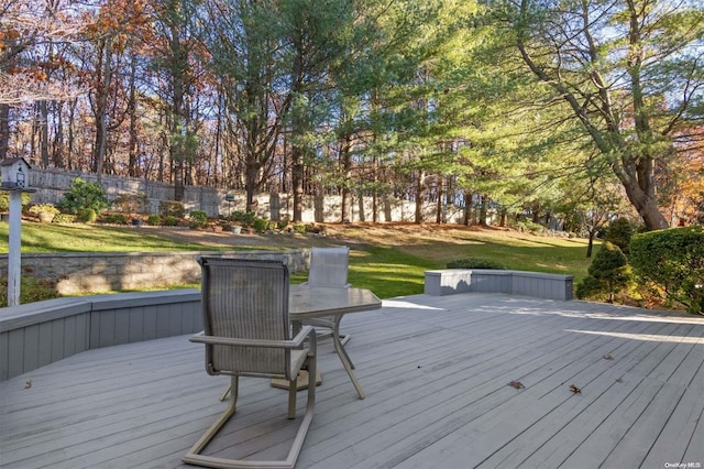 wooden terrace with a lawn