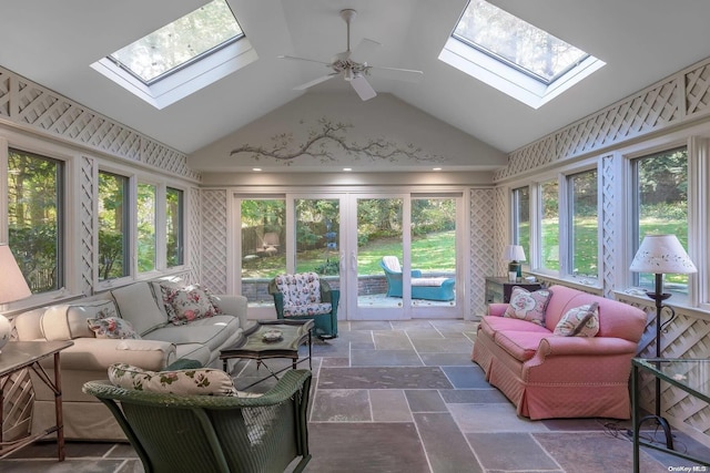 sunroom featuring ceiling fan and vaulted ceiling with skylight