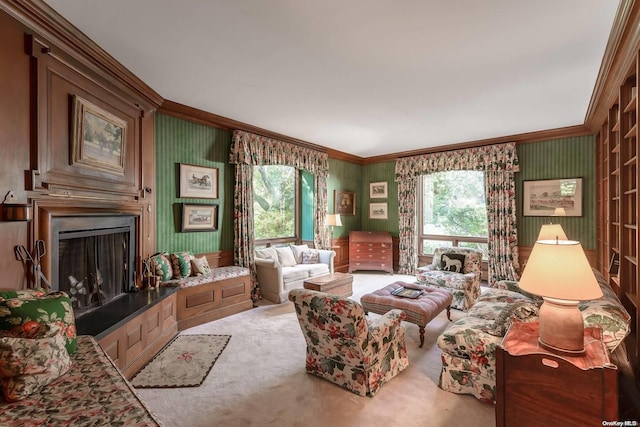 carpeted living room featuring ornamental molding