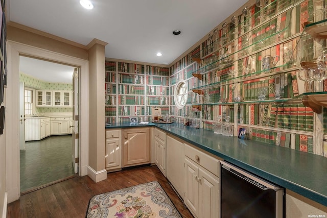 bar with dishwasher and dark hardwood / wood-style flooring