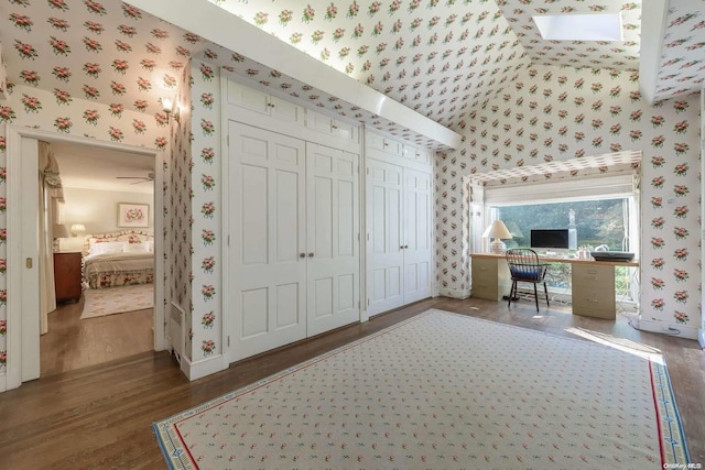 home office featuring lofted ceiling and wood-type flooring